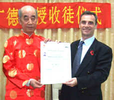 Simon receives his 6th Duan certificate from Professor Zhang